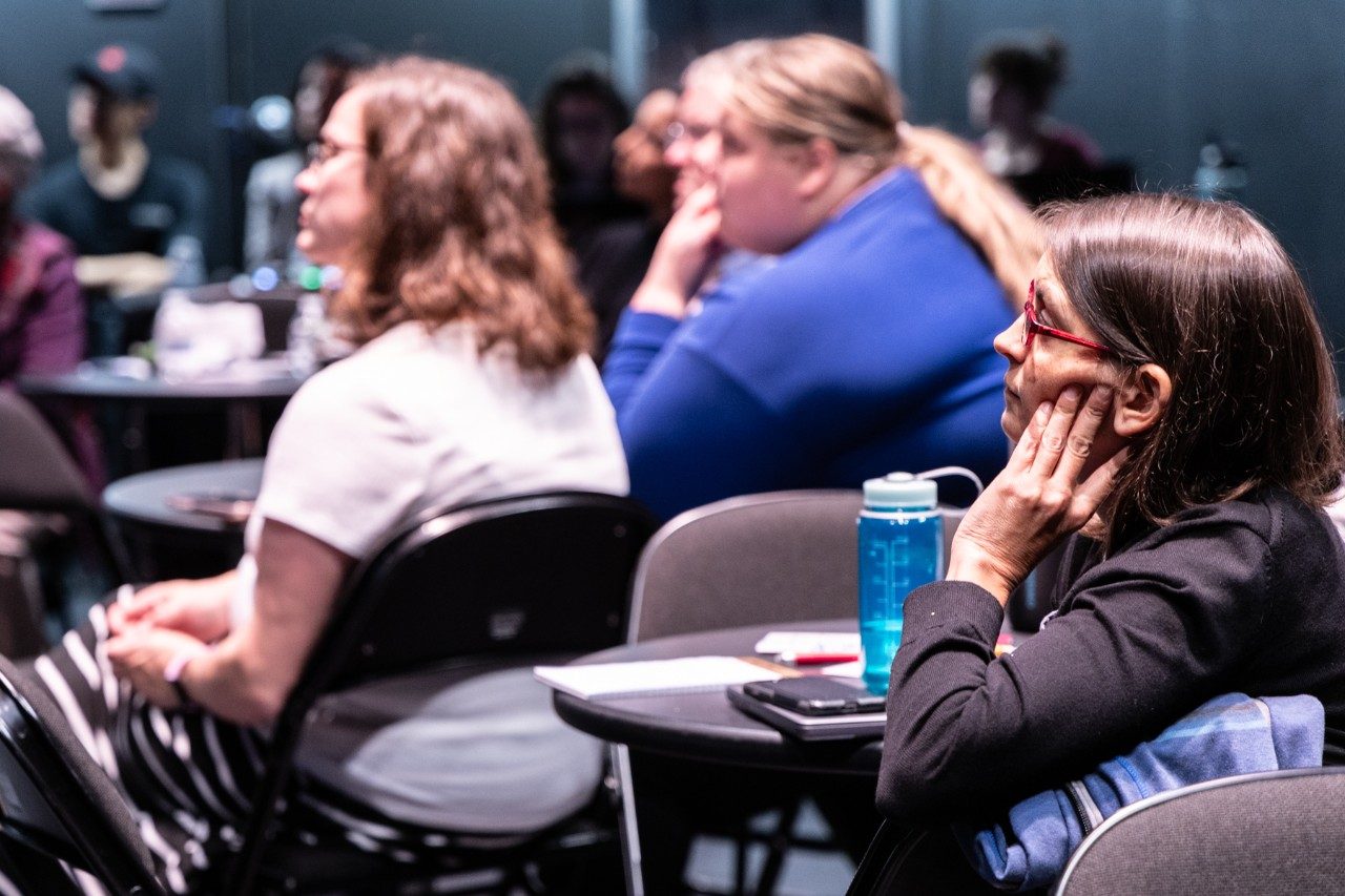 Audience members listen to remarks during the 2024 NDEAM event.